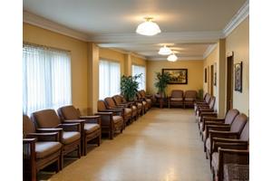 Before image of an outdated and sterile senior living common area